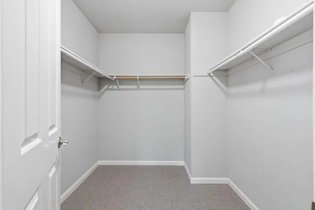 a bathroom with a granite countertop sink double and mirror