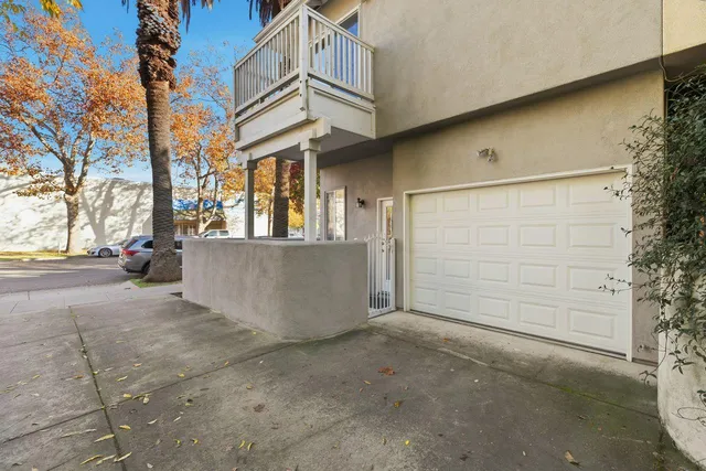 a view of a house with a large tree