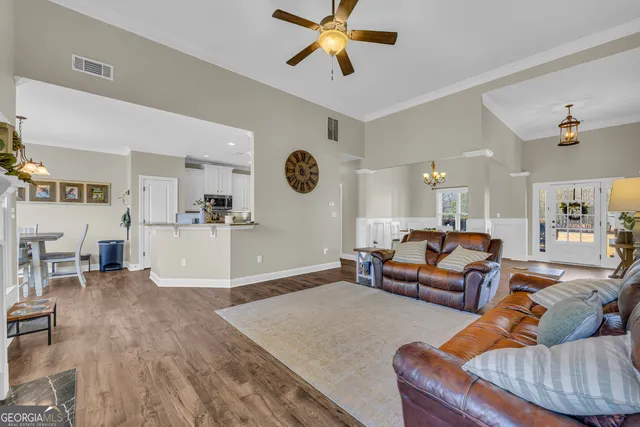 a kitchen with stainless steel appliances granite countertop a stove top oven a sink and dishwasher