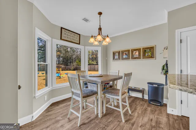 a kitchen with granite countertop cabinets a sink a counter space and stainless steel appliances