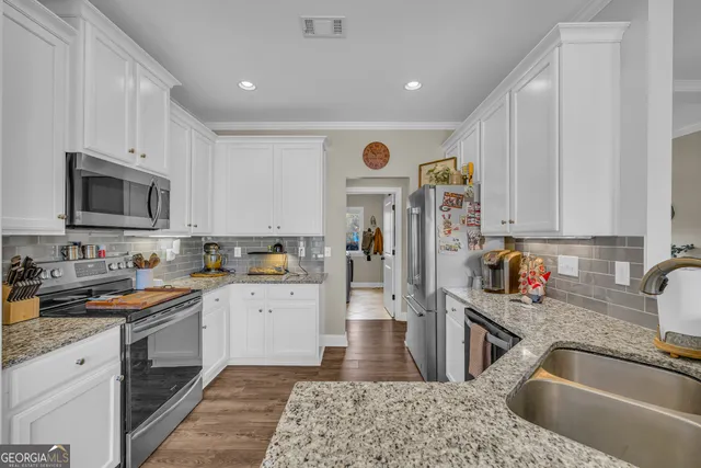 a bathroom with a sink a mirror and a shower