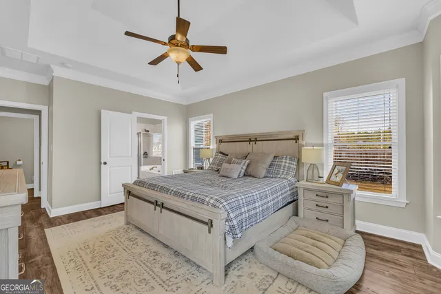 a view of walk in closet with clothes