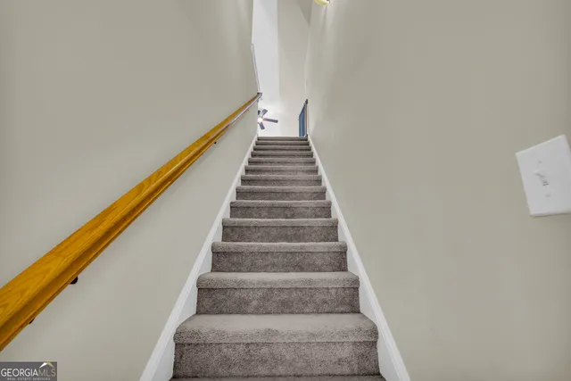 a swimming pool with trees in the background