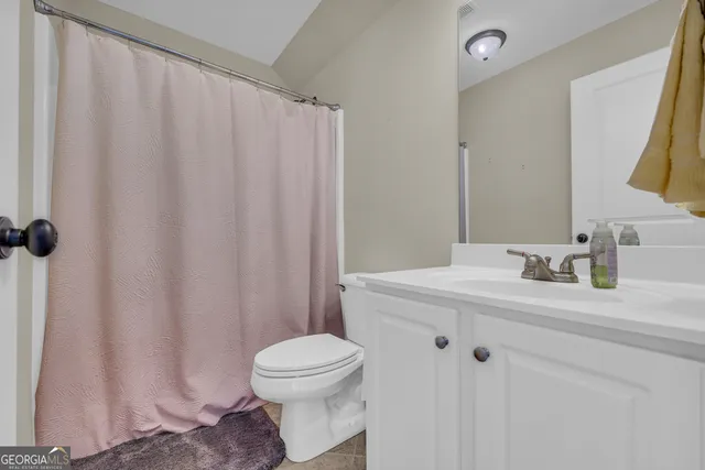 a view of a patio with a table and chairs