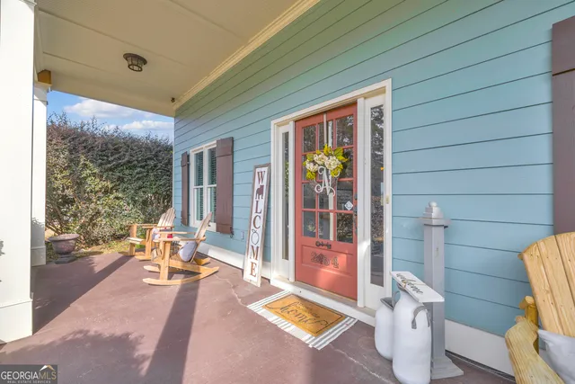 a living room with furniture fireplace and a chandelier