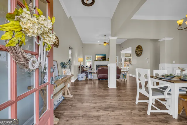 a view of a dining room with furniture and wooden floor