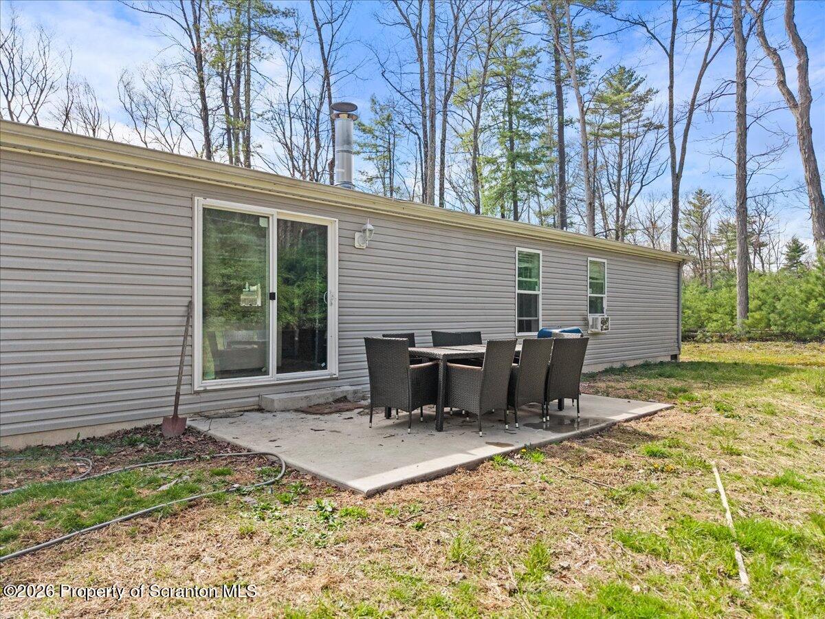 396 Park Road Dingmans Ferry, PA 18328 - Photo 31 of 39 a view of a house with backyard and sitting area