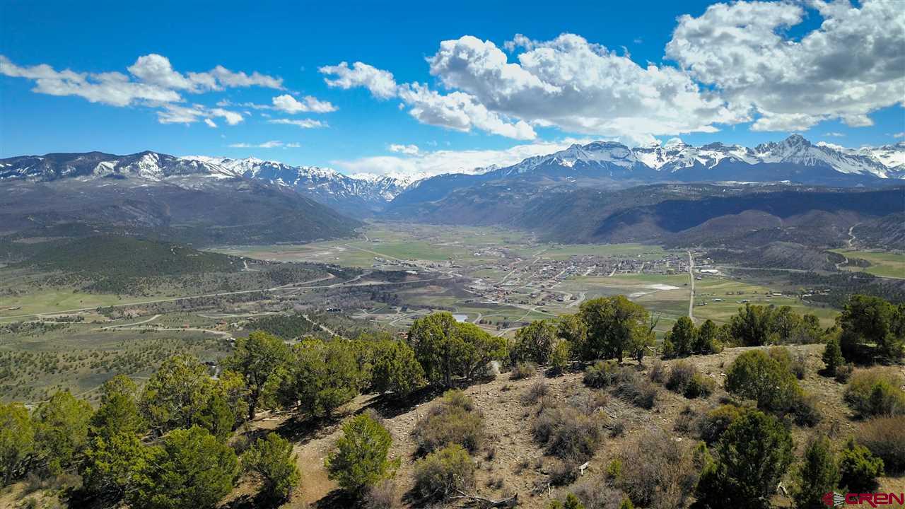 802 H Pine Drive Ridgway, CO 81432 - Photo 9 of 20 a view of a lake with mountains in the background