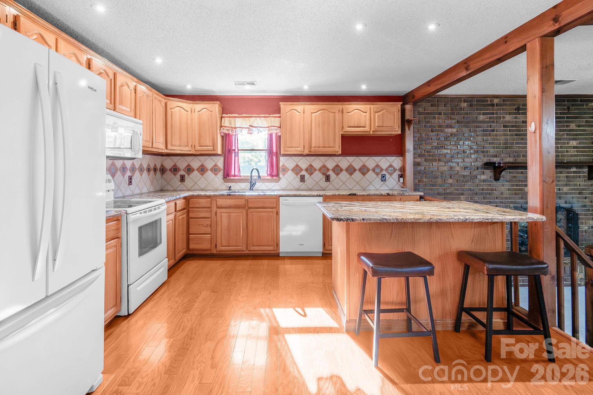 1295 Cattle Ridge Road Cheraw, SC 29520 - Photo 11 of 21 a kitchen with a sink stove and cabinets