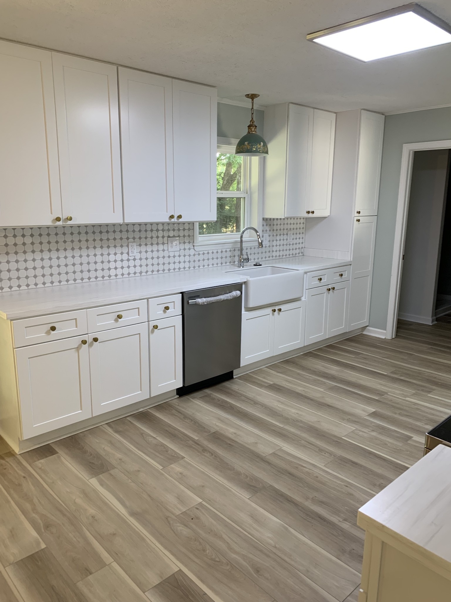 5870 Chestnut Bluff Road Friendship, TN 38034 - Photo 8 of 19 a kitchen with granite countertop white cabinets and sink