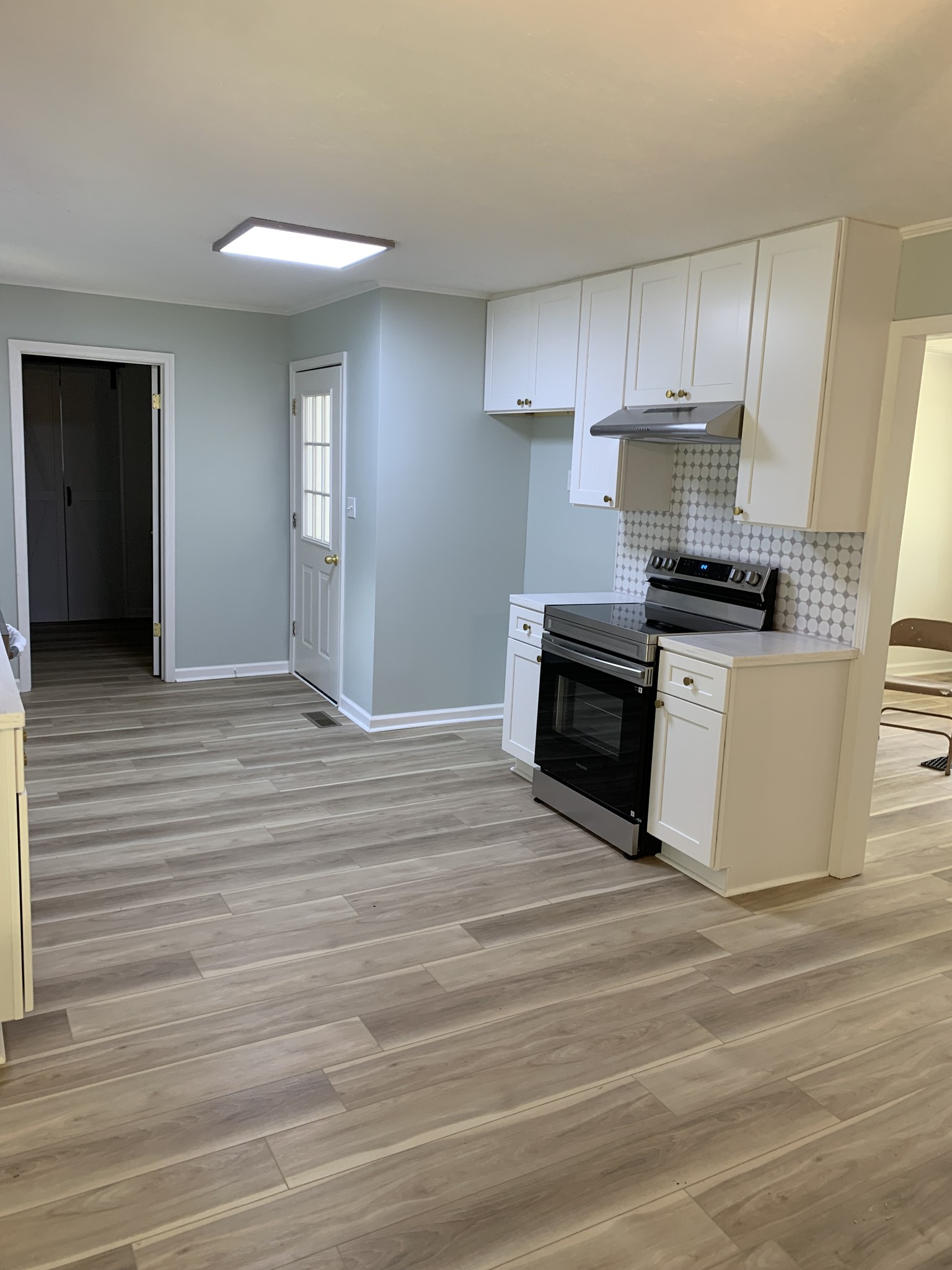 5870 Chestnut Bluff Road Friendship, TN 38034 - Photo 9 of 19 a kitchen with granite countertop a stove and a sink