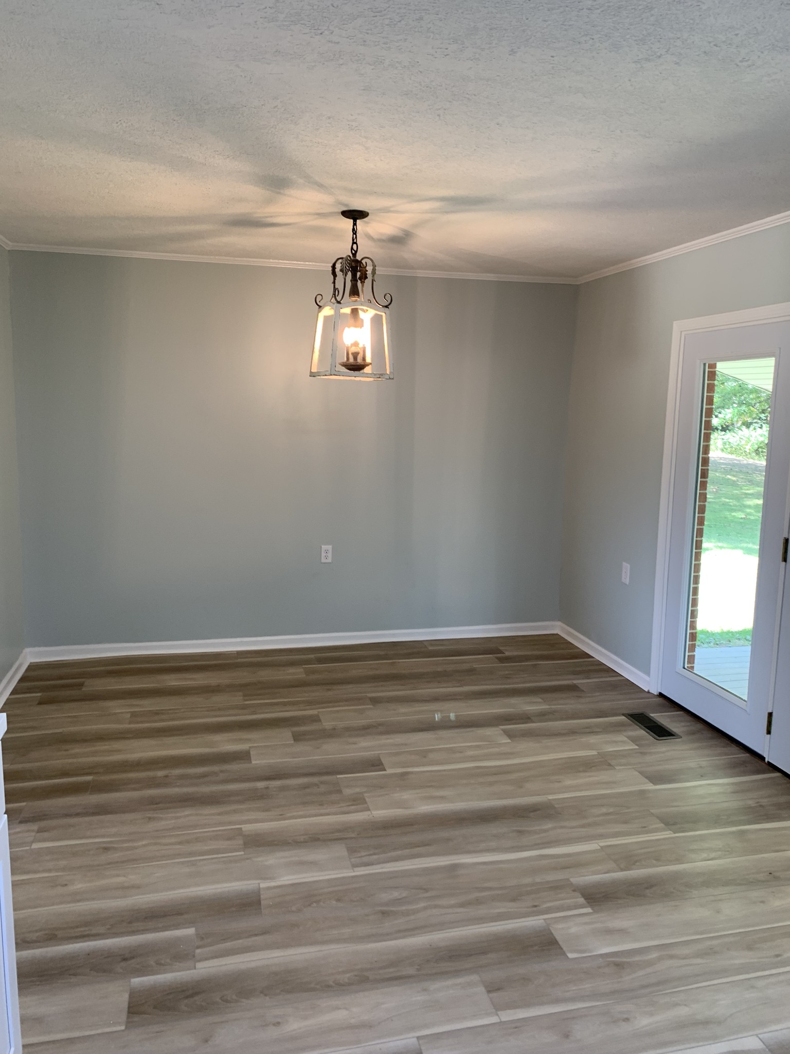 5870 Chestnut Bluff Road Friendship, TN 38034 - Photo 10 of 19 a view of empty room with window and wooden floor