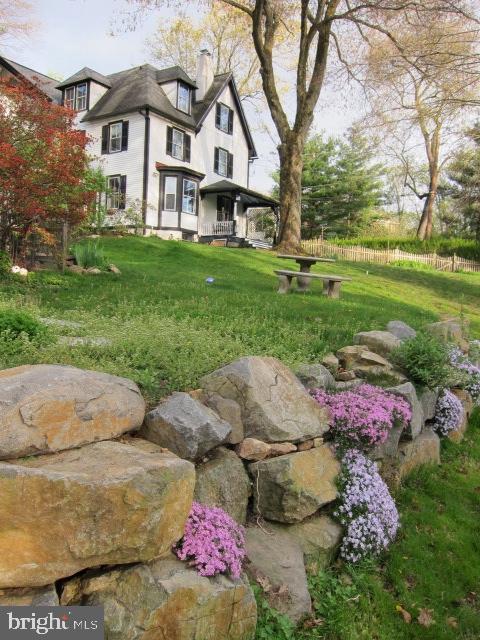 938 Summit Road Narberth, PA 19072 - Photo 55 of 60 Stone Retaining wall with blooms