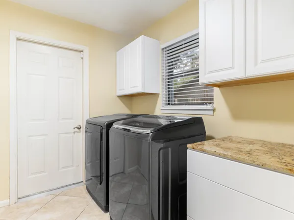 a kitchen with a stove and a refrigerator