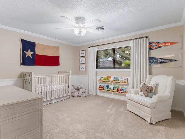 a spacious bedroom with a bed and a couch