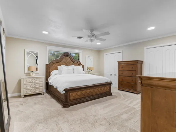 a bathroom with a double vanity sink mirror and shower