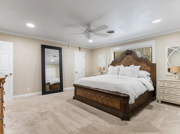 a bathroom with a double vanity sink mirror and toilet