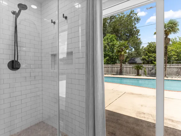 a view of swimming pool with a yard