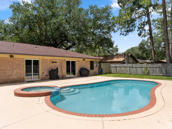 a view of swimming pool with seating space