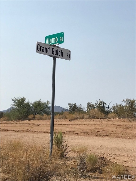 7709 Shadow Ridge Drive Yucca, AZ 86438 - Photo 33 of 39 a street sign on a road next to a lake