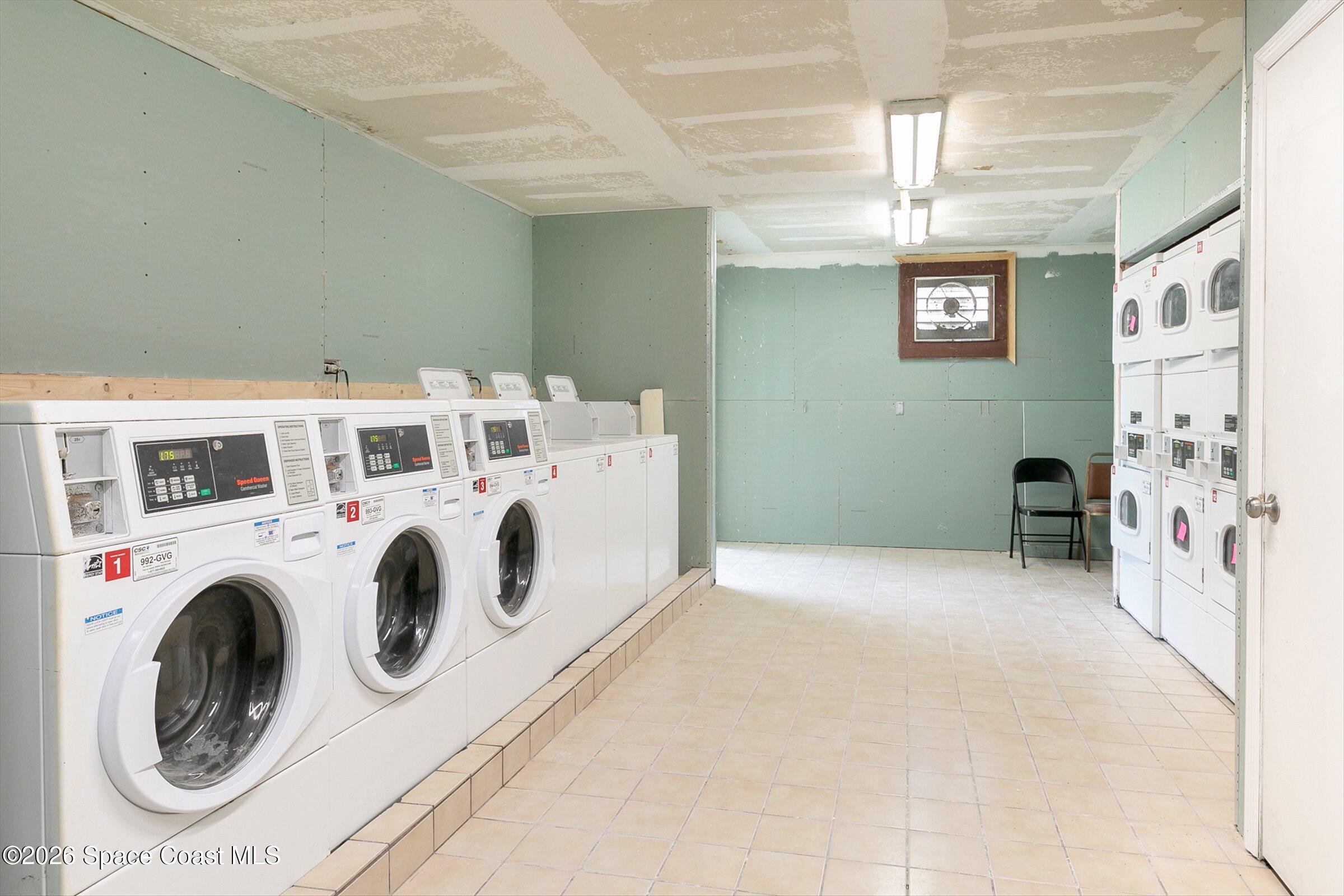 1225 North Wickham Road, Unit 223 Melbourne, FL 32935 - Photo 18 of 26 a utility room with dryer and washer