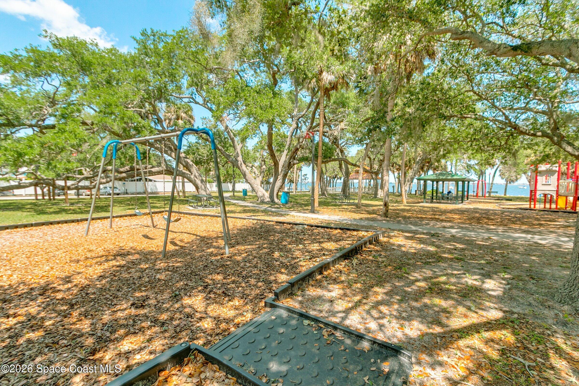 1225 North Wickham Road, Unit 223 Melbourne, FL 32935 - Photo 23 of 26 a view of yard with trees