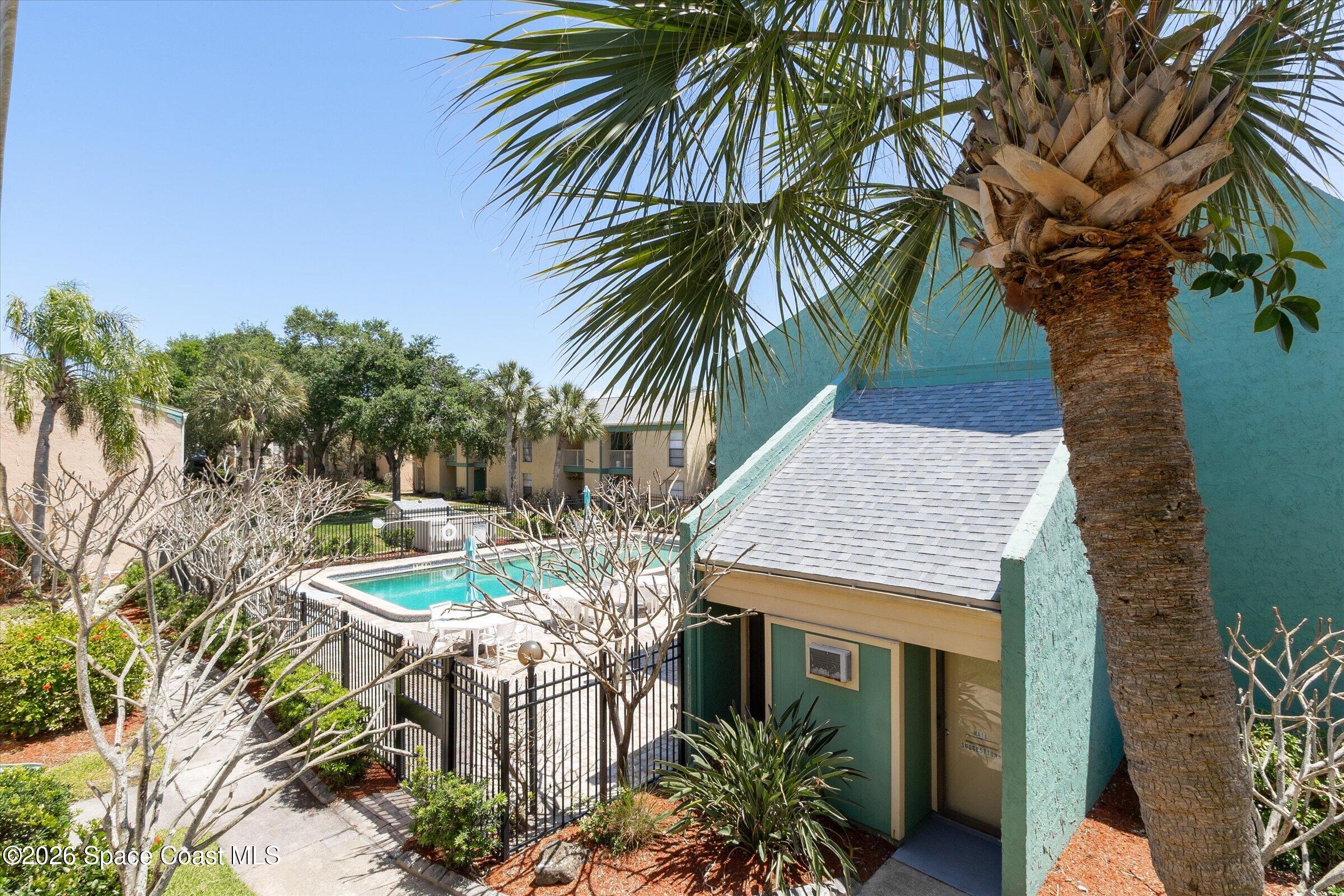 1225 North Wickham Road, Unit 223 Melbourne, FL 32935 - Photo 6 of 26 a view of a dinning table and chairs in patio