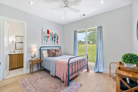 a bedroom with a bed and a table