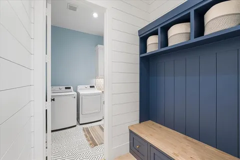 a bathroom with a granite countertop sink and a toilet