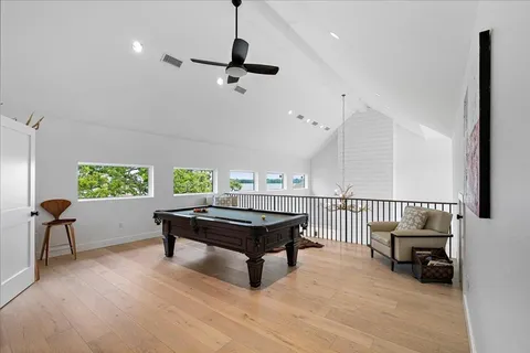 a living room with furniture a rug and white walls