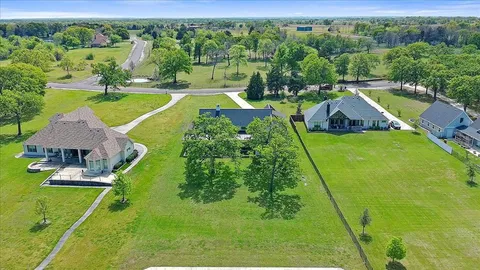 a view of a swimming pool and a yard