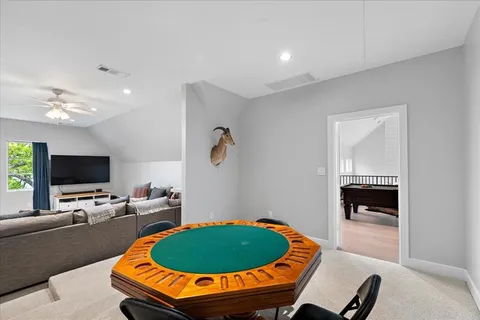 a room with furniture and a flat screen tv