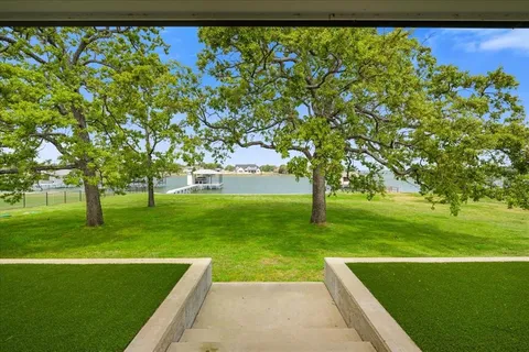a view of yard with swimming pool and green space