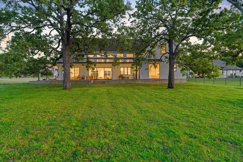 a big yard with large trees