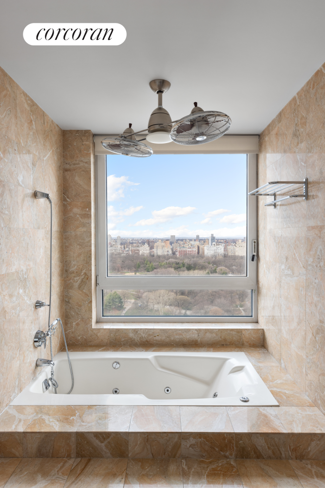 30 East 85th Street, Unit 26/27B Manhattan, NY 10028 - Photo 19 of 25 a bathroom with a tub and a window