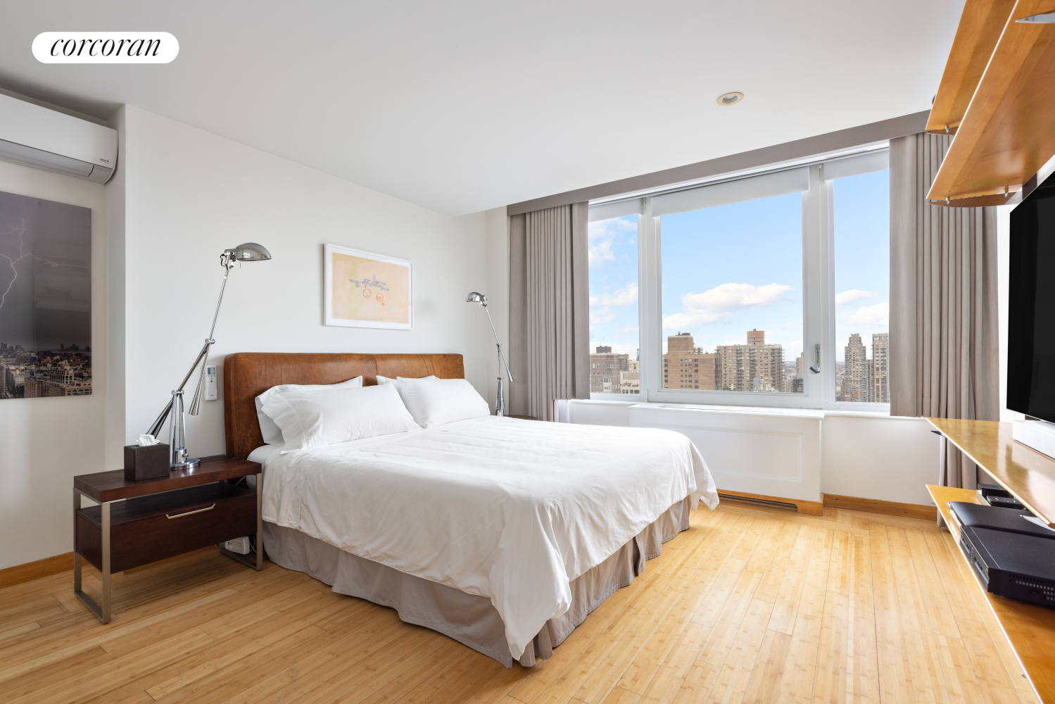 30 East 85th Street, Unit 26/27B Manhattan, NY 10028 - Photo 22 of 25 a bedroom with a bed and a large window