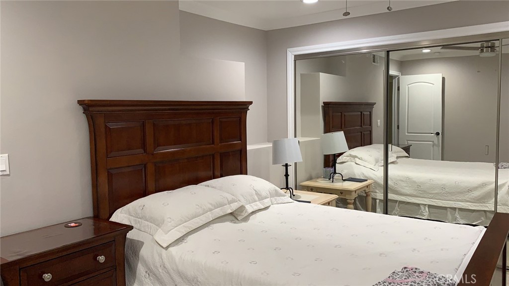 509 West Duarte Road, Unit B Monrovia, CA 91016 - Photo 13 of 20 a bedroom with a bed and a mirror