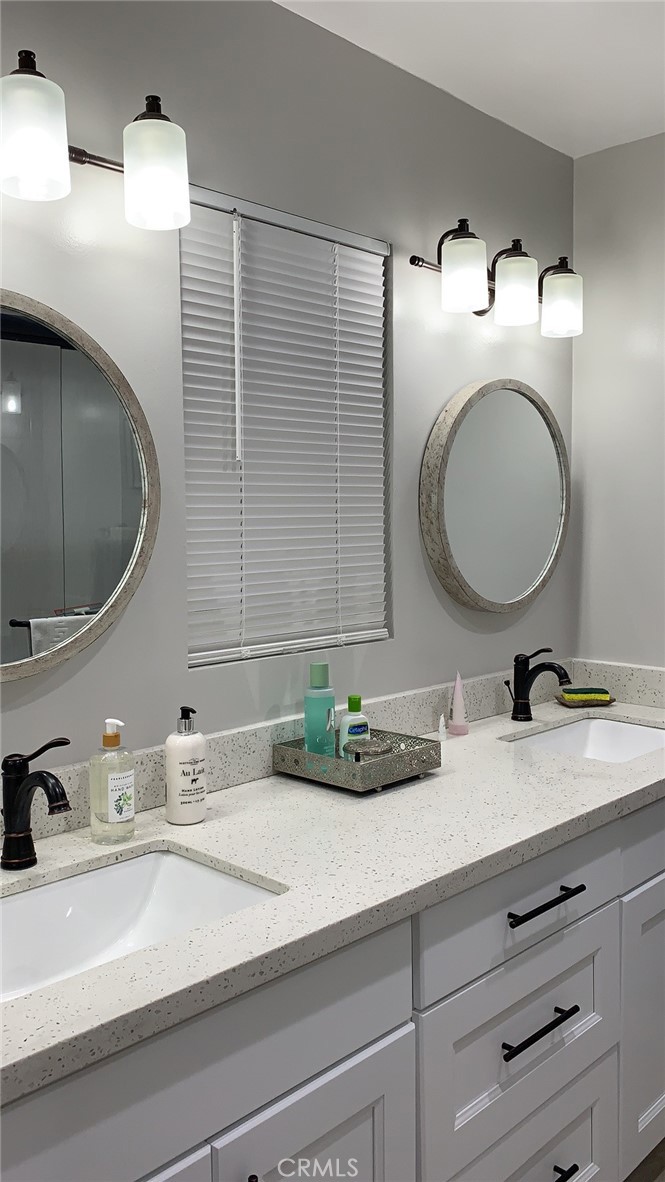 509 West Duarte Road, Unit B Monrovia, CA 91016 - Photo 14 of 20 a bathroom with a double vanity sink and mirror