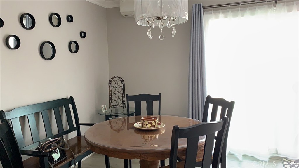 509 West Duarte Road, Unit B Monrovia, CA 91016 - Photo 6 of 20 a view of a dining room with furniture and wooden floor