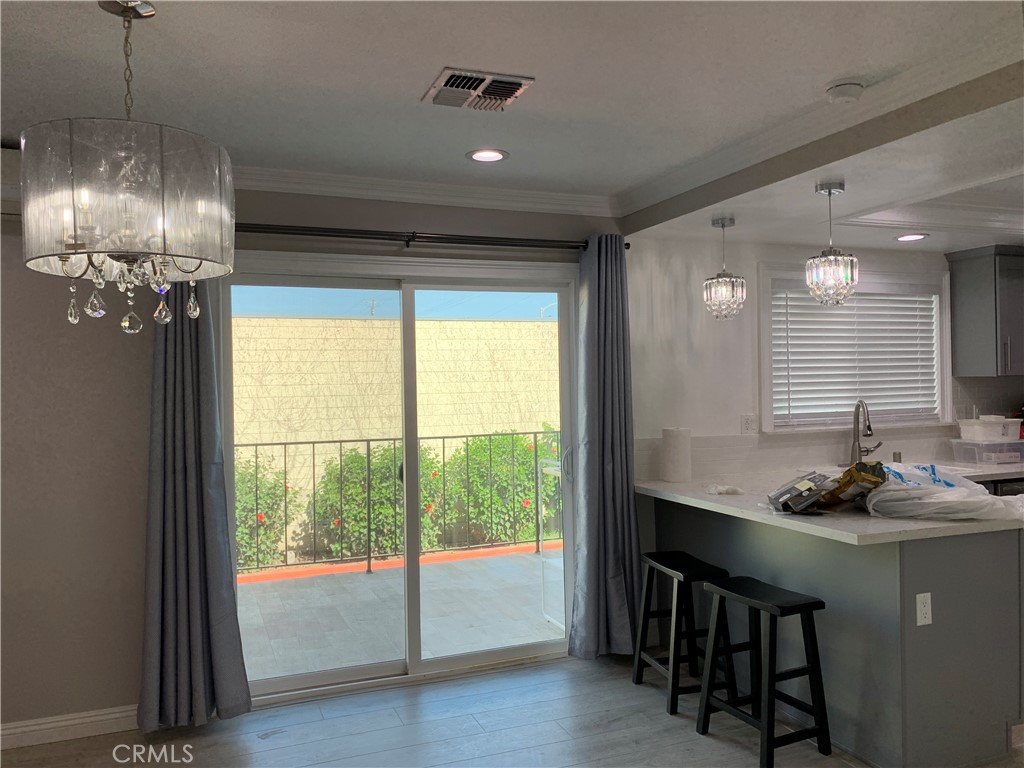 509 West Duarte Road, Unit B Monrovia, CA 91016 - Photo 7 of 20 a kitchen with a table chairs and chandelier