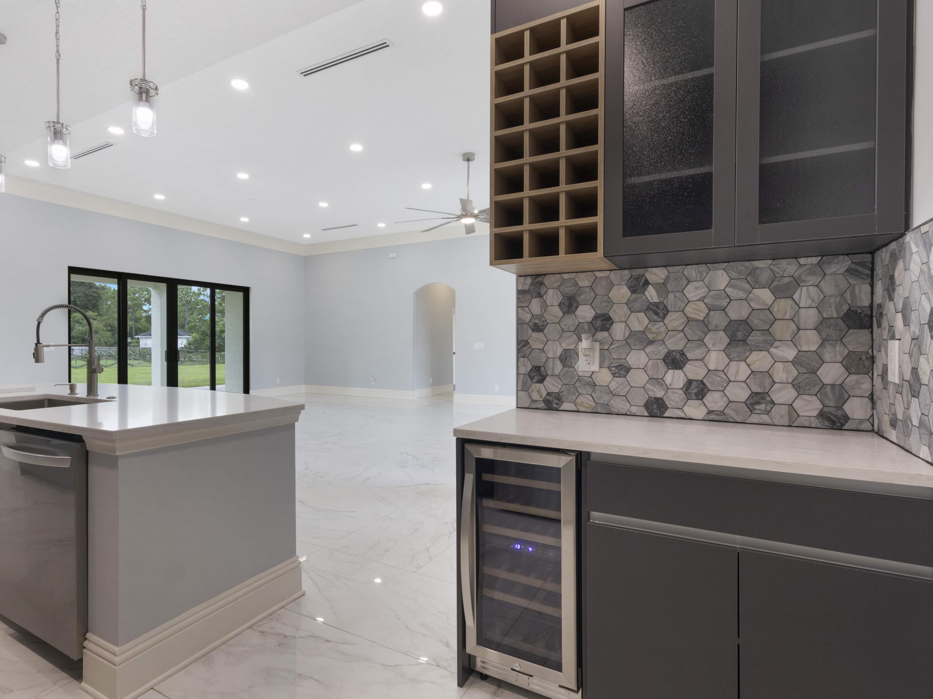 17436 71st Lane North Loxahatchee, FL 33470 - Photo 17 of 50 a view of kitchen with window and cabinets