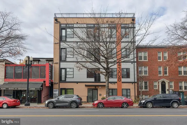 a view of a cars parked in front of a building