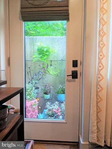 a vase of flowers sitting on a floor