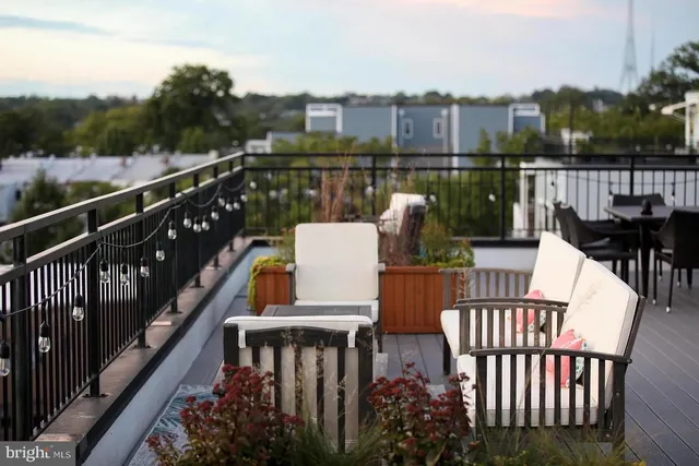a view of a terrace with furniture