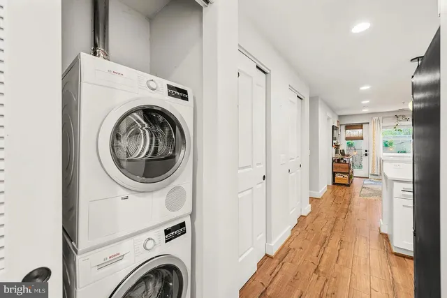 a view of a hallway with washer and dryer