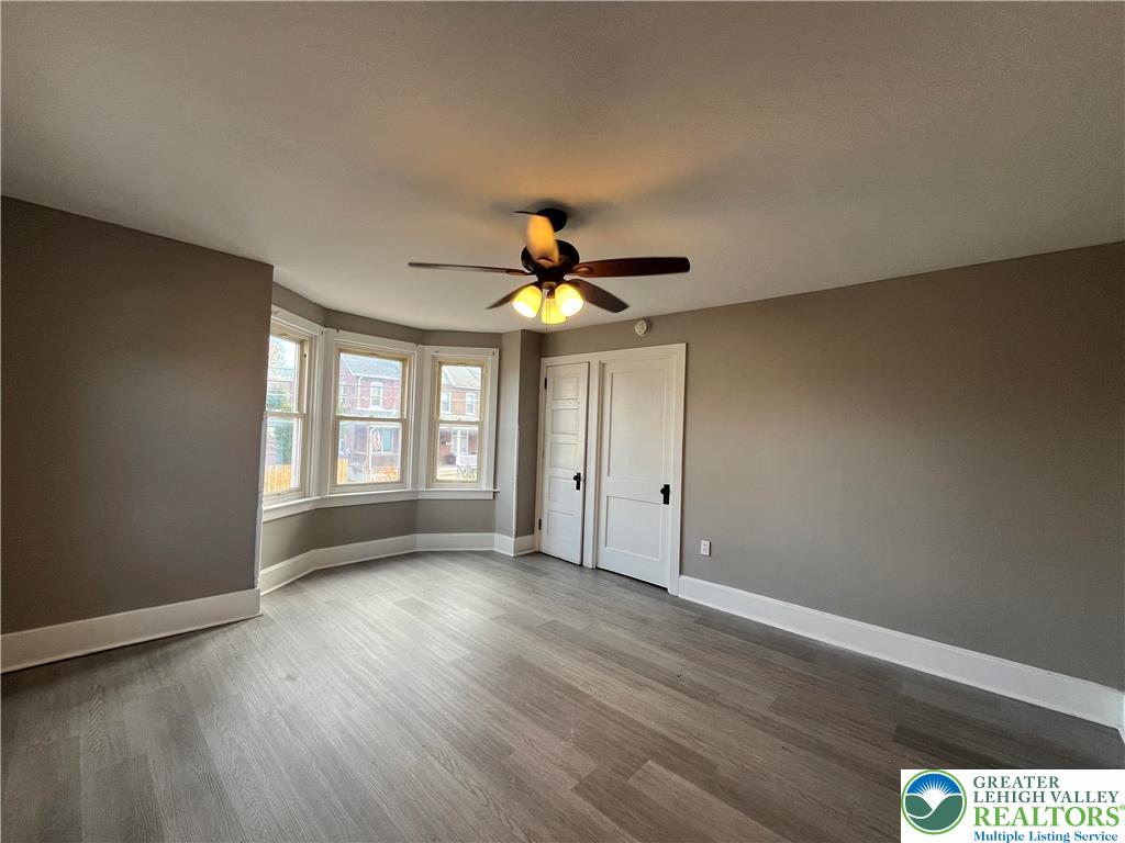 2402-2404 South 4th Street Allentown, PA 18103 - Photo 11 of 21 a view of an empty room with window and wooden floor