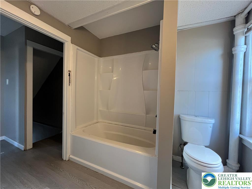 2402-2404 South 4th Street Allentown, PA 18103 - Photo 17 of 21 a bathroom with a toilet and a bathtub
