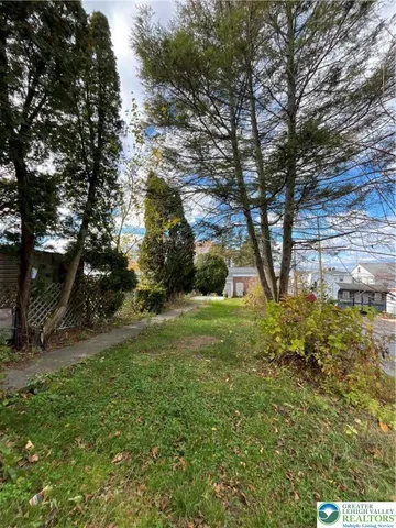 a view of backyard with green space