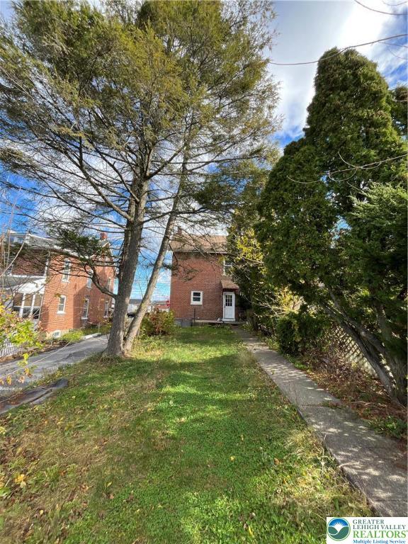 2402-2404 South 4th Street Allentown, PA 18103 - Photo 21 of 21 a tall tree in middle of the green field