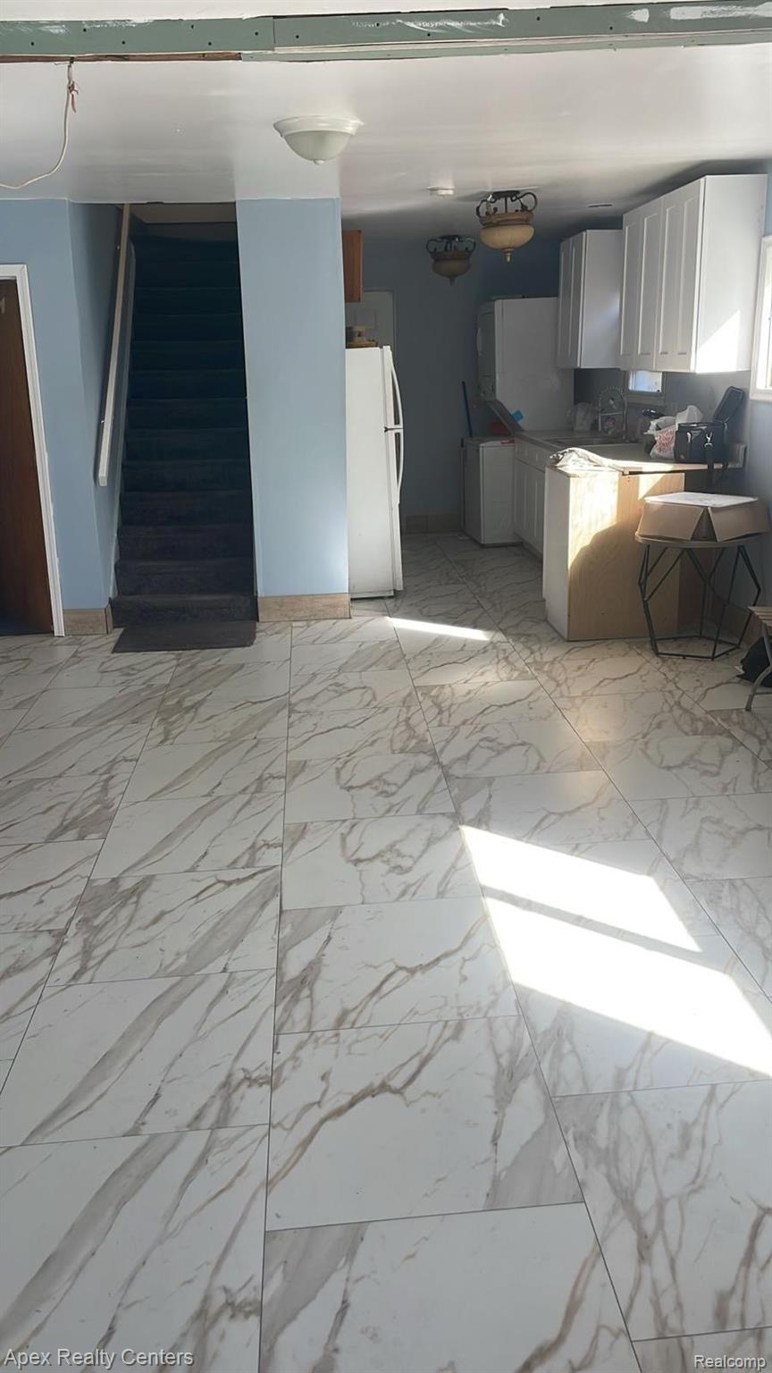 6730 Forrer Street Detroit, MI 48228 - Photo 3 of 10 Tiled flooring with a white and gray veined pattern throughout